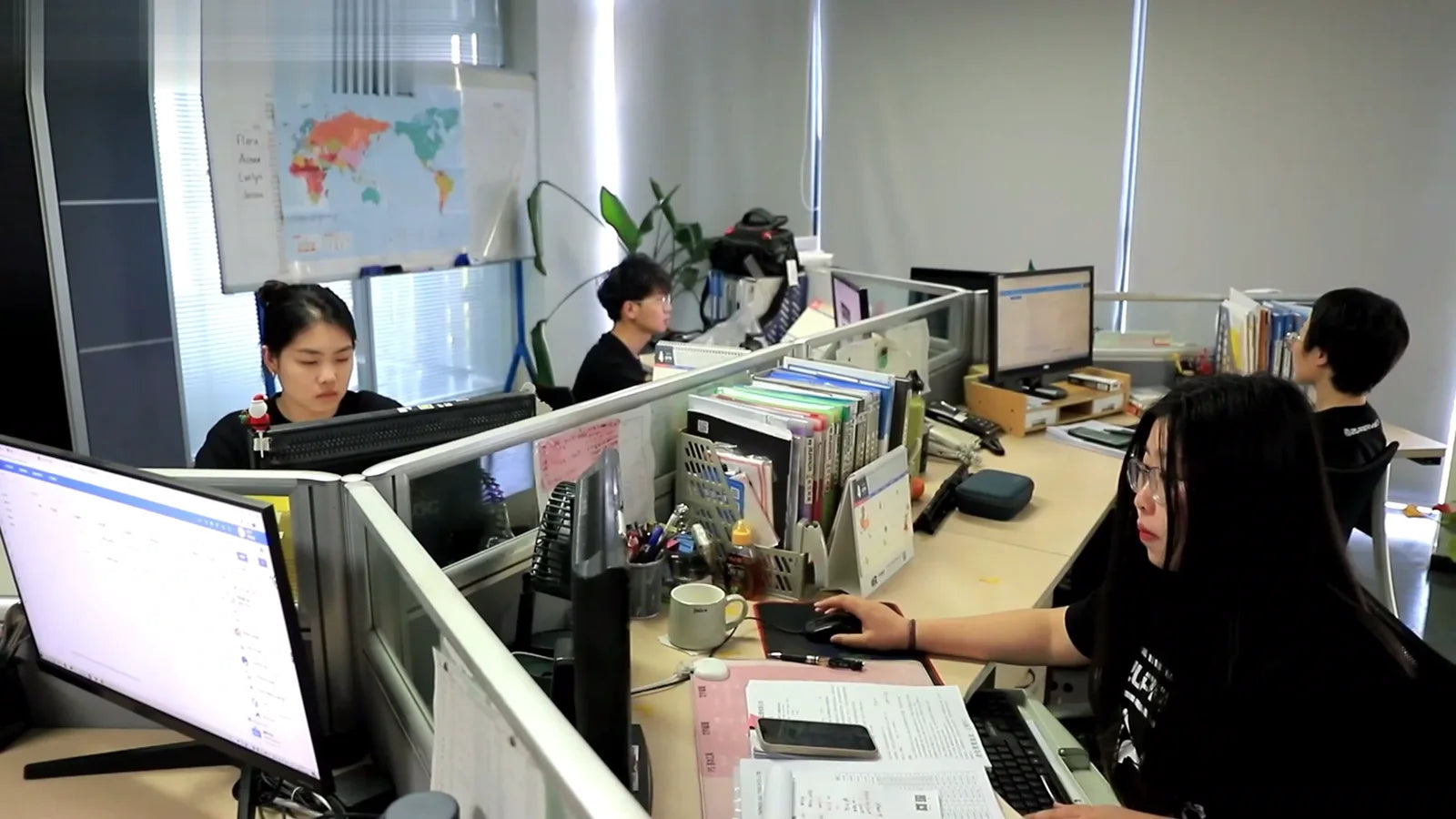 ZUPPER customer support and operations team working in the company office